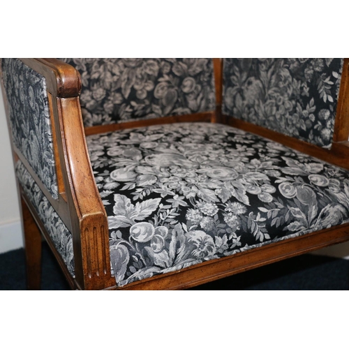 499 - Antique French Empire style armchair upholstered in black floral patterned fabric, raised on fluted ... 