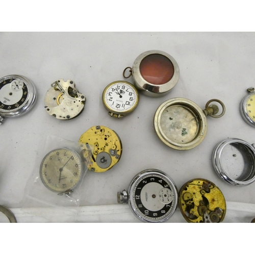 96 - Large bag of pocket watch spares to include cases.