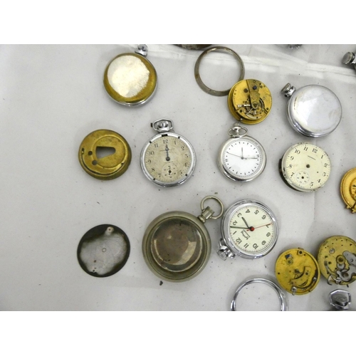 96 - Large bag of pocket watch spares to include cases.