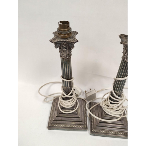 101 - Pair of e.p. table lamps with Corinthian columns on stepped beaded bases, 33.5cm including fittings,... 