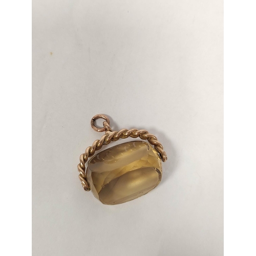 105 - 9ct gold curb pattern swivel seal with faceted citrine 1914.