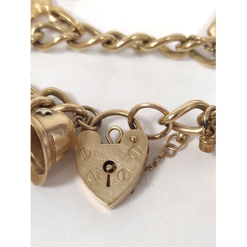 109 - 9ct gold charm bracelet with various charms including a 22ct gold ring (2g approximately) 24g in all... 