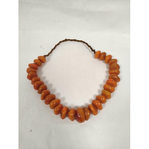 132 - Baltic amber bead necklace of flattened circular beads. 155g