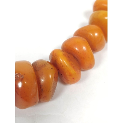 132 - Baltic amber bead necklace of flattened circular beads. 155g