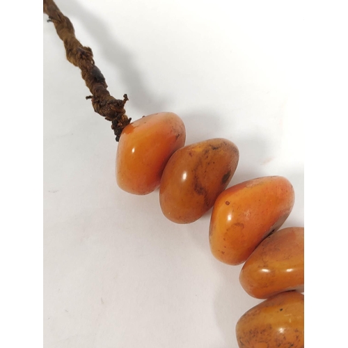 132 - Baltic amber bead necklace of flattened circular beads. 155g