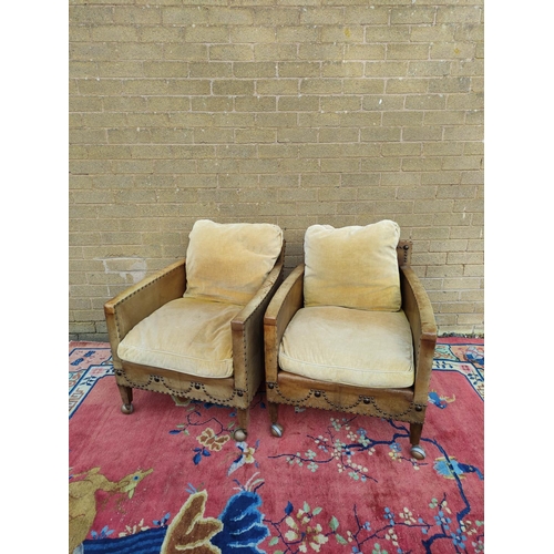 415 - Pair of Regency style hide upholstered low arm chairs, circa early 20th century, with studded decora... 