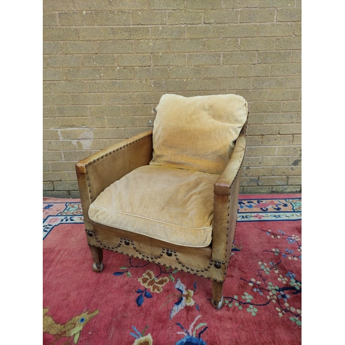 415 - Pair of Regency style hide upholstered low arm chairs, circa early 20th century, with studded decora... 