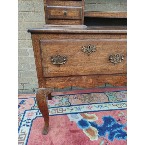 418 - Georgian style oak dresser. upper section with shaped apron above open delft shelving flanked with f... 