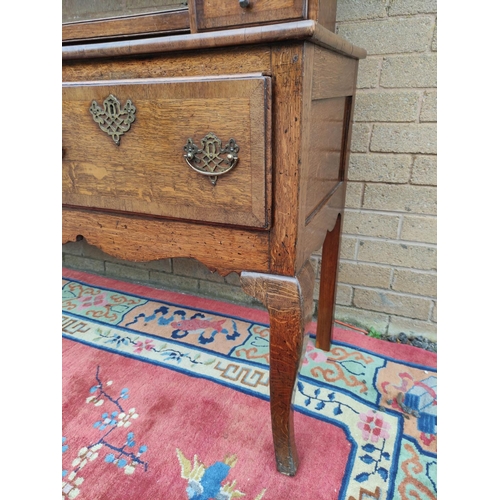 418 - Georgian style oak dresser. upper section with shaped apron above open delft shelving flanked with f... 