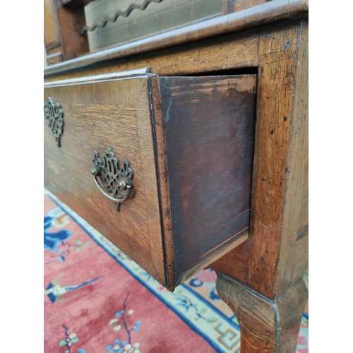 418 - Georgian style oak dresser. upper section with shaped apron above open delft shelving flanked with f... 