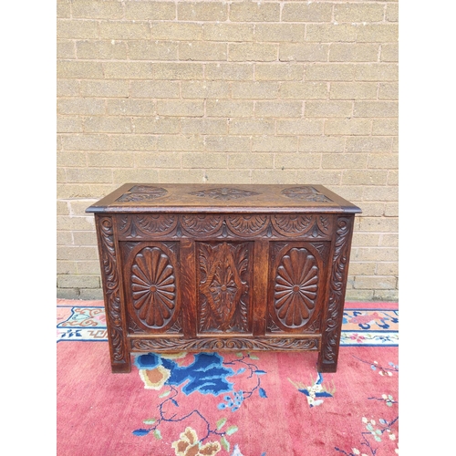 419 - Antique oak coffer with hinged top, decorated with carved lozenge decoration. 69cm high, 92cm wide, ... 