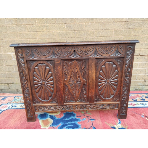 419 - Antique oak coffer with hinged top, decorated with carved lozenge decoration. 69cm high, 92cm wide, ... 