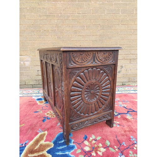 419 - Antique oak coffer with hinged top, decorated with carved lozenge decoration. 69cm high, 92cm wide, ... 