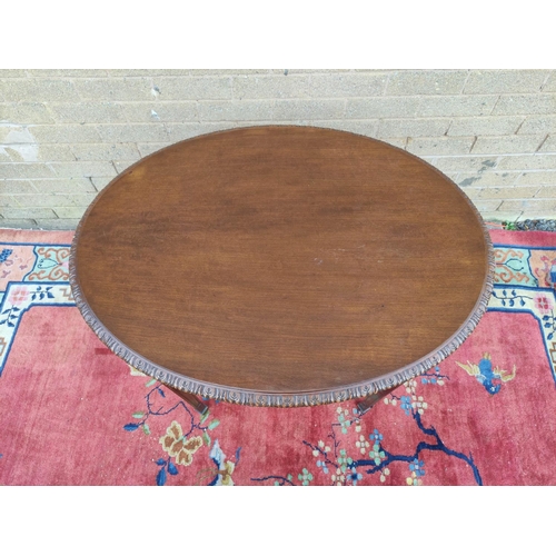 423 - Chippendale revival mahogany oval side table, decorated with moulded floral swags on tapered support... 