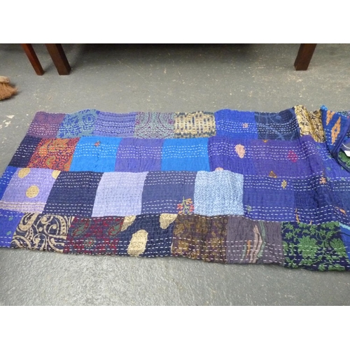 219 - Large modern double patchwork quilt; also a large woven shawl with Paisley pattern decoration.