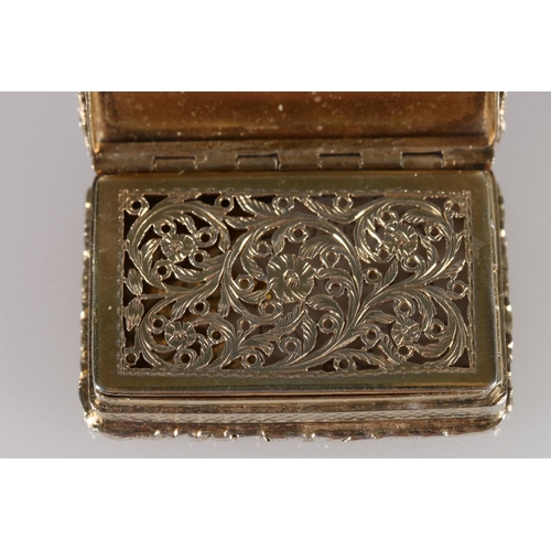 82 - William IV antique silver gilt vinaigrette with engine turned decoration and relief scrolling flower... 