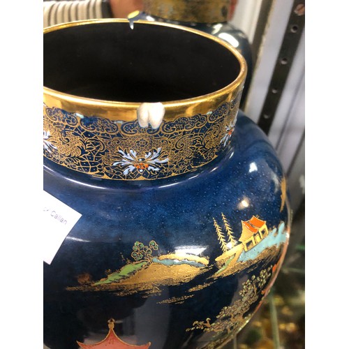 9 - Carlton Ware blue ground baluster vase with gilt dog handled lid and pagoda design on wooden stand, ... 