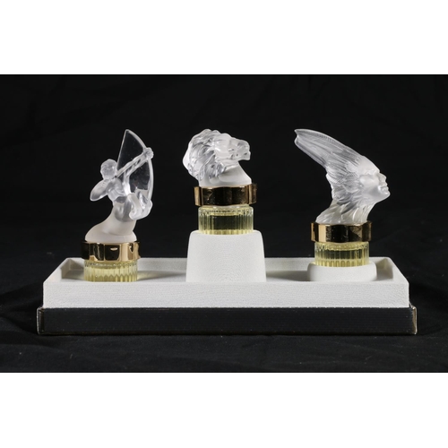 404 - Lalique of France, three frosted glass perfume bottles from the 'Flacons Collection Mascottes' colle... 