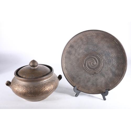 440 - Jim Etzkorn of Canada, a Canadian studio pottery twin handled lidded bowl and matching charger or st... 