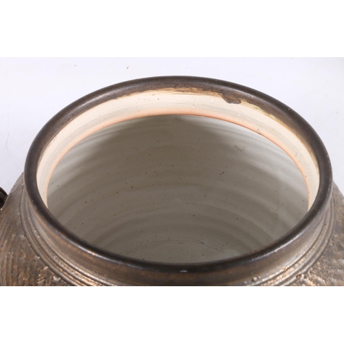 440 - Jim Etzkorn of Canada, a Canadian studio pottery twin handled lidded bowl and matching charger or st... 