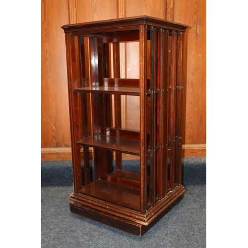 511 - Antique mahogany and satinwood strung revolving bookcase in the Sheraton Revival manner, the square ... 