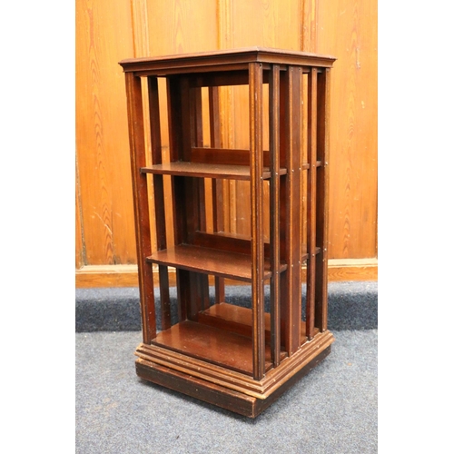 511 - Antique mahogany and satinwood strung revolving bookcase in the Sheraton Revival manner, the square ... 