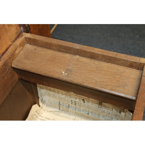 512 - Antique oak blanket box, the hinged top opening to reveal interior with candle box, the front with f... 