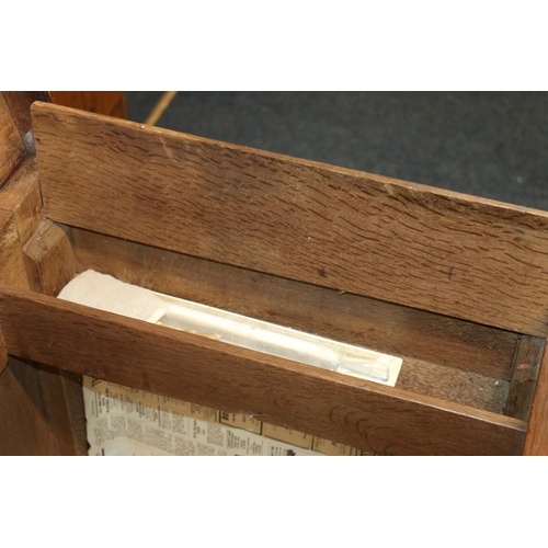 512 - Antique oak blanket box, the hinged top opening to reveal interior with candle box, the front with f... 