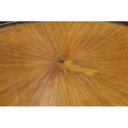 515 - French Empire style oval coffee table with pierced metal gallery, raised on circular tapering fluted... 