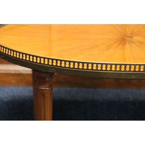 515 - French Empire style oval coffee table with pierced metal gallery, raised on circular tapering fluted... 