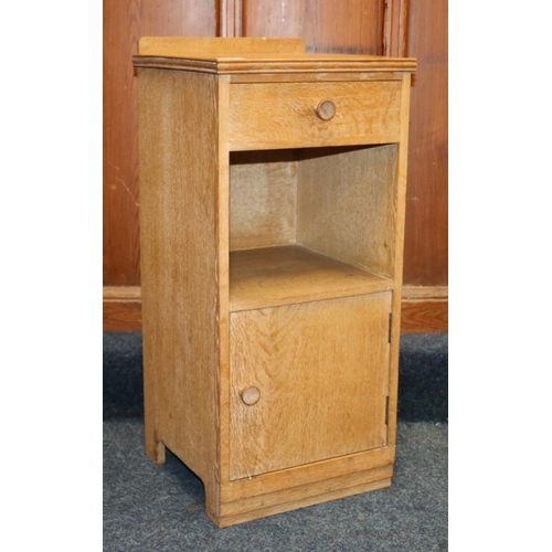 516 - Heals of London, a limed oak ledge back bedside cabinet, Heals button to the inside of the drawer, 7... 