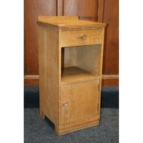 516 - Heals of London, a limed oak ledge back bedside cabinet, Heals button to the inside of the drawer, 7... 