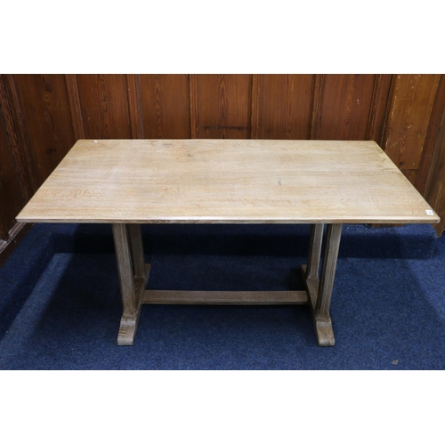 520 - Manner of Heals of London, an Arts & Crafts style limed oak refectory style dining table raised ... 