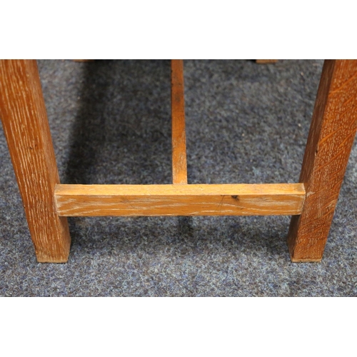 521 - Manner of Heals of London, a limed oak framed dressing table stool, 43cm wide.