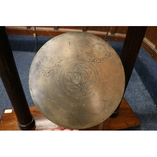 526 - Chinese gong, the oak frame of temple form supporting a circular bronze gong with character mark and... 