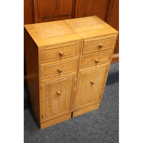 517 - Heals of London, a limed oak cabinet (made up) having four short drawers above two cupboard doors, r... 