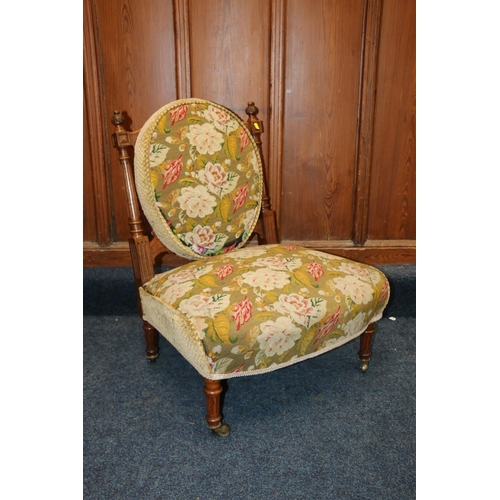 525 - Victorian walnut framed nursing chair, upholstered in green floral patterned needlework covering, ra... 