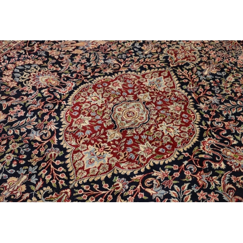 544 - Persian Khorasan style rug, the dark-coloured field with central leaf shaped panel surrounded by scr... 