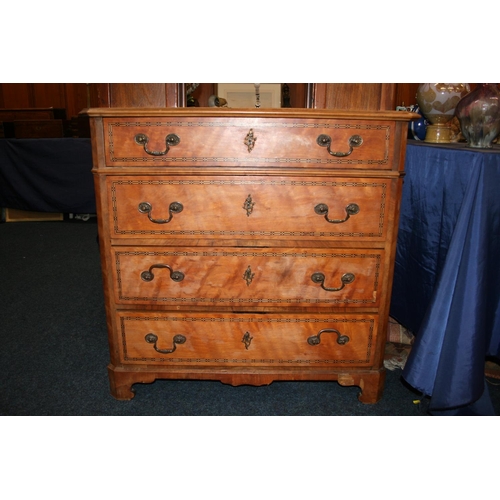 504 - Satinwood and chequered banded chest of drawers, the rectangular top with canted corners  and m... 