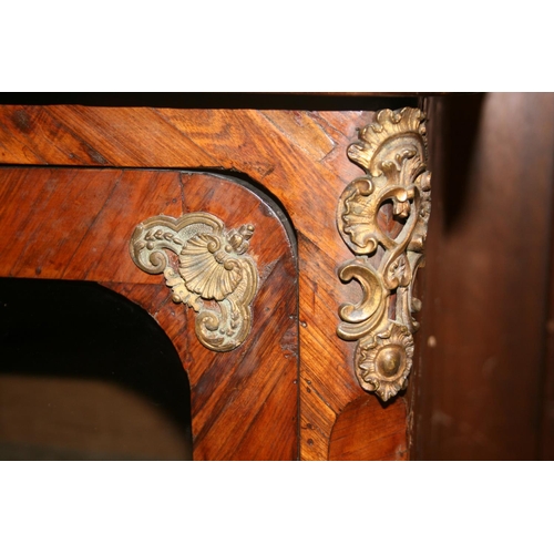 508 - French walnut two door cabinet, the serpentine edged marble top above two glazed panel doors, ormolu... 