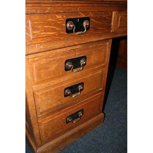 509 - 20th century oak partner's desk of typical form, 182cm wide, 121cm deep, 78cm tall.