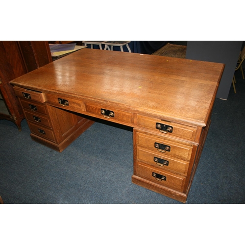 509 - 20th century oak partner's desk of typical form, 182cm wide, 121cm deep, 78cm tall.