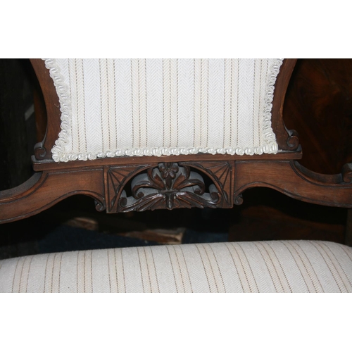 513 - Pair of antique mahogany framed armchairs, the top rail with C scroll and floral carved design, upho... 