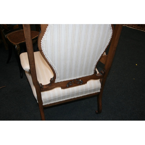 513 - Pair of antique mahogany framed armchairs, the top rail with C scroll and floral carved design, upho... 