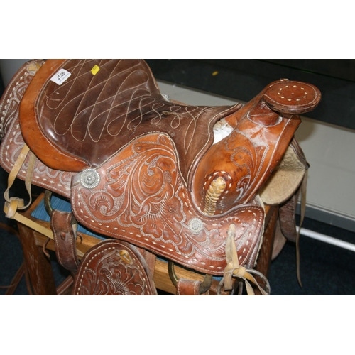 531 - Tooled leather saddle complete with straps and metal fittings by Buffalo Saddle Company.