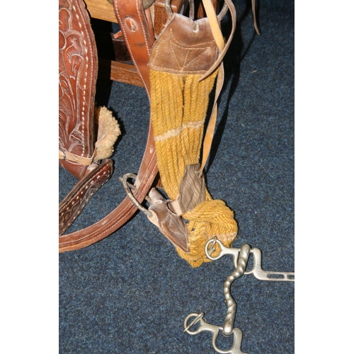 531 - Tooled leather saddle complete with straps and metal fittings by Buffalo Saddle Company.