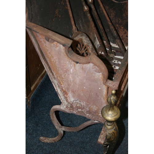 532 - Antique cast metal fire basket with shaped arch top, raised on brass lion leg supports terminating i... 