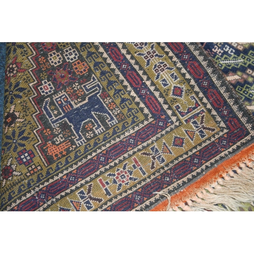 537 - Persian style green ground rug, the midnight blue field with large central lozenge having cross to t... 