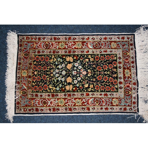 541 - Indian or Turkish silk rug, the dark field decorated with flowering branch design, multiple guard bo... 