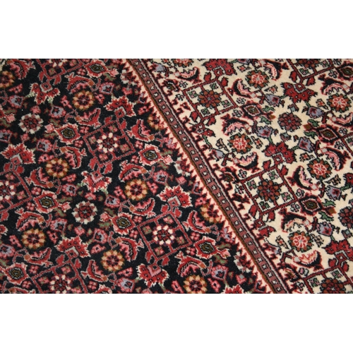 543 - Persian Bidjar style rug, the red ground with large cream gul with smaller red gul to the interior, ... 